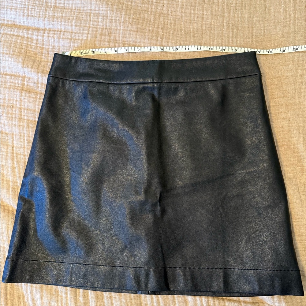 Faux-leather A-line mini skirt. Smoke free home, only worn 1x for a short event
